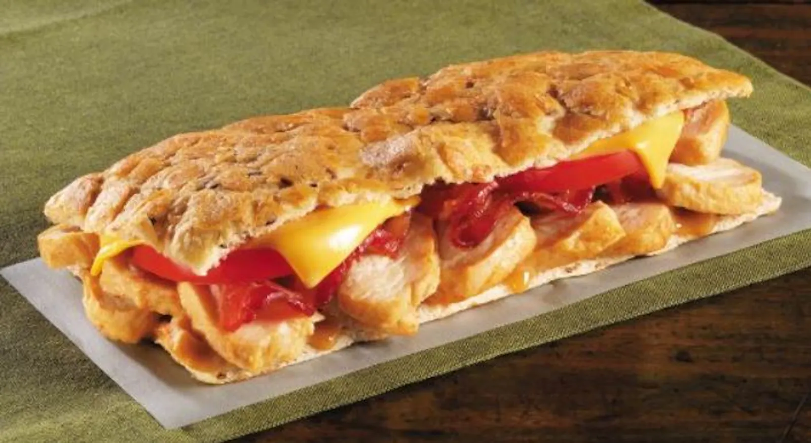 A Cos&igrave; Bacon Turkey Cheddar melt on hearth-fired flatbread