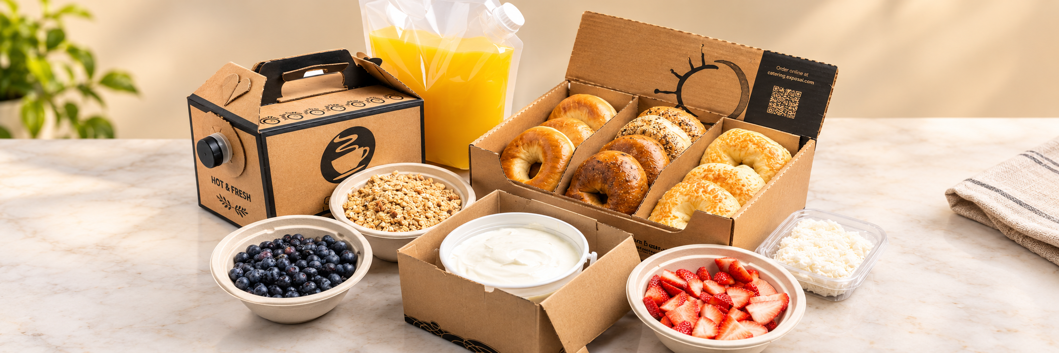 Cos&igrave; breakfast catering with coffee, orange juice, a bagel, and a yogurt parfait
