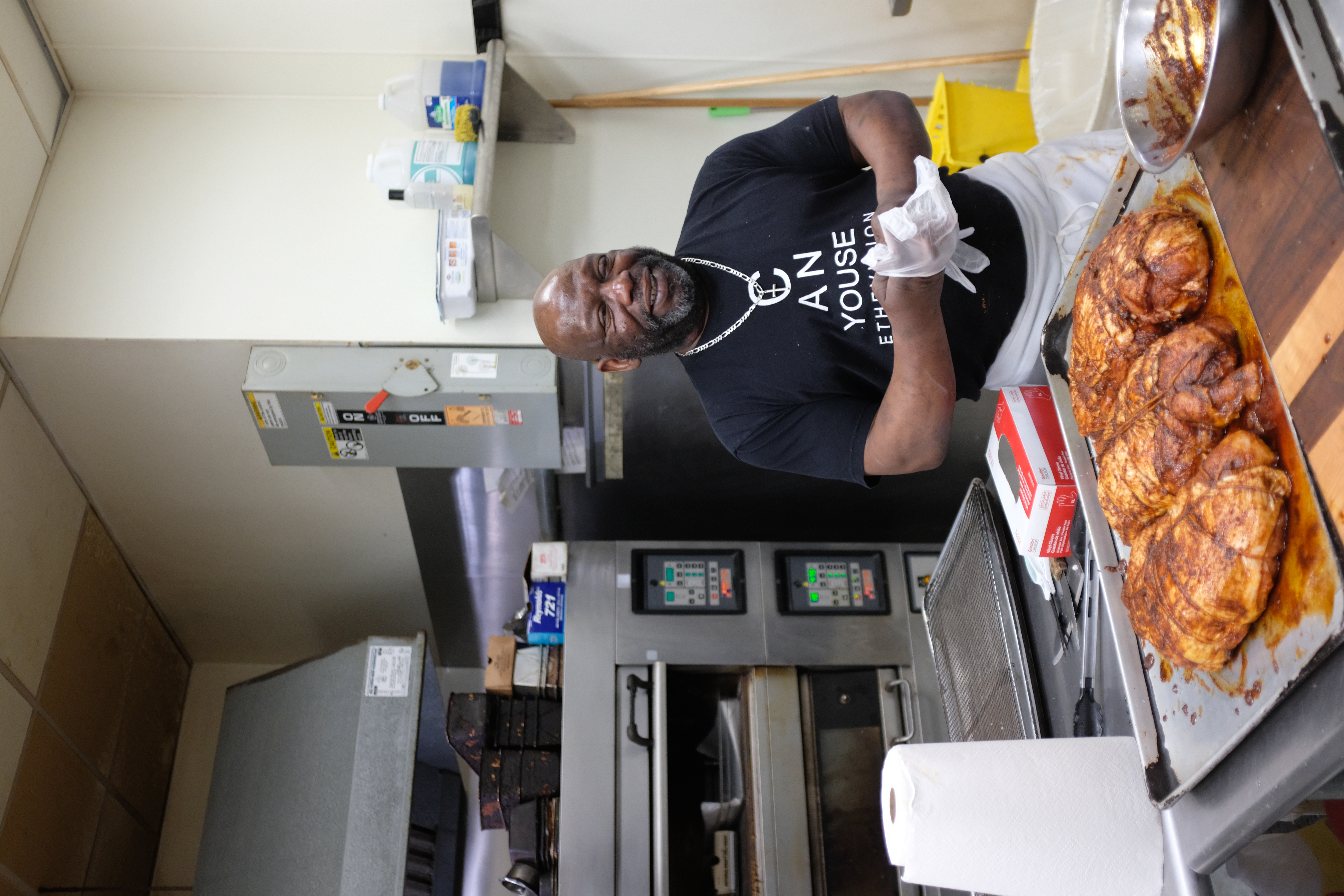 a person cooking in a kitchen preparing food