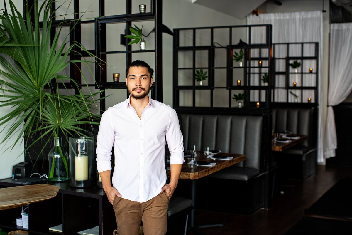 a man standing in front of a table