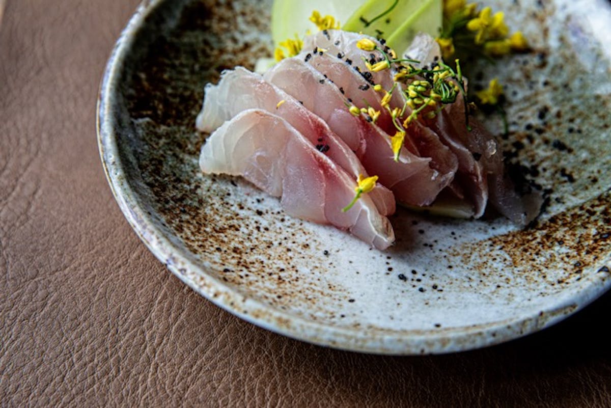 a plate with tuna and veggies