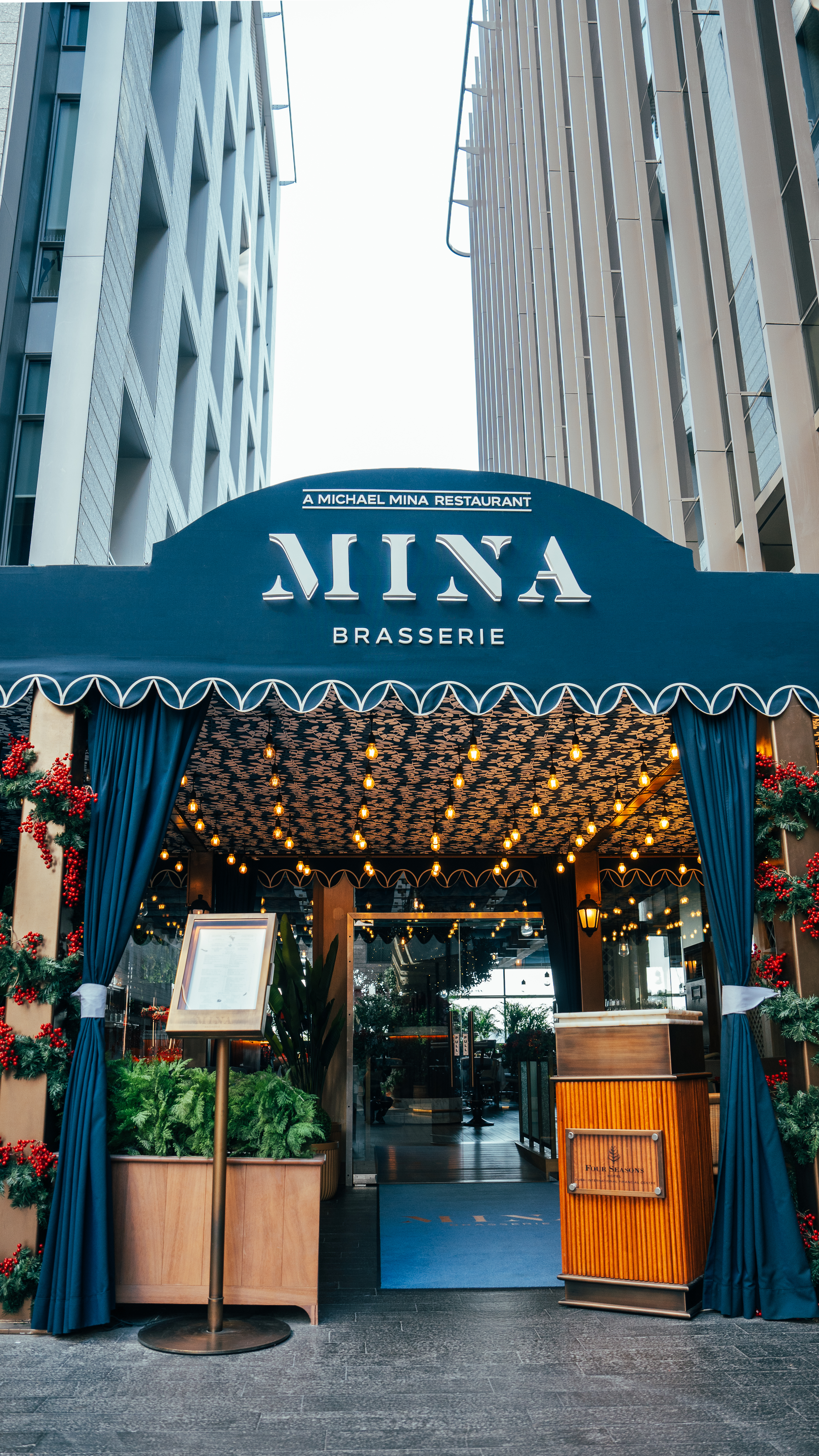 a blue sign in front of a building