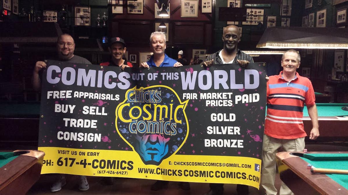 a group of people standing in front of a sign