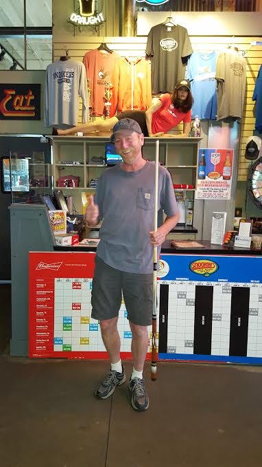 a man standing in front of a store