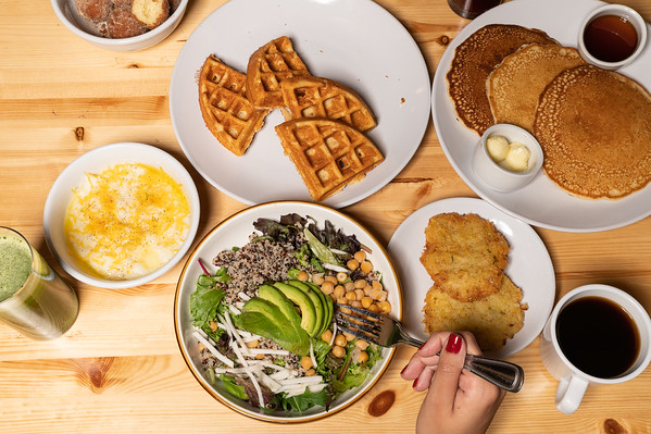 a bunch of food sitting on top of a wooden table