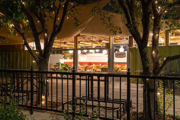 a bus that is sitting on top of a wooden fence
