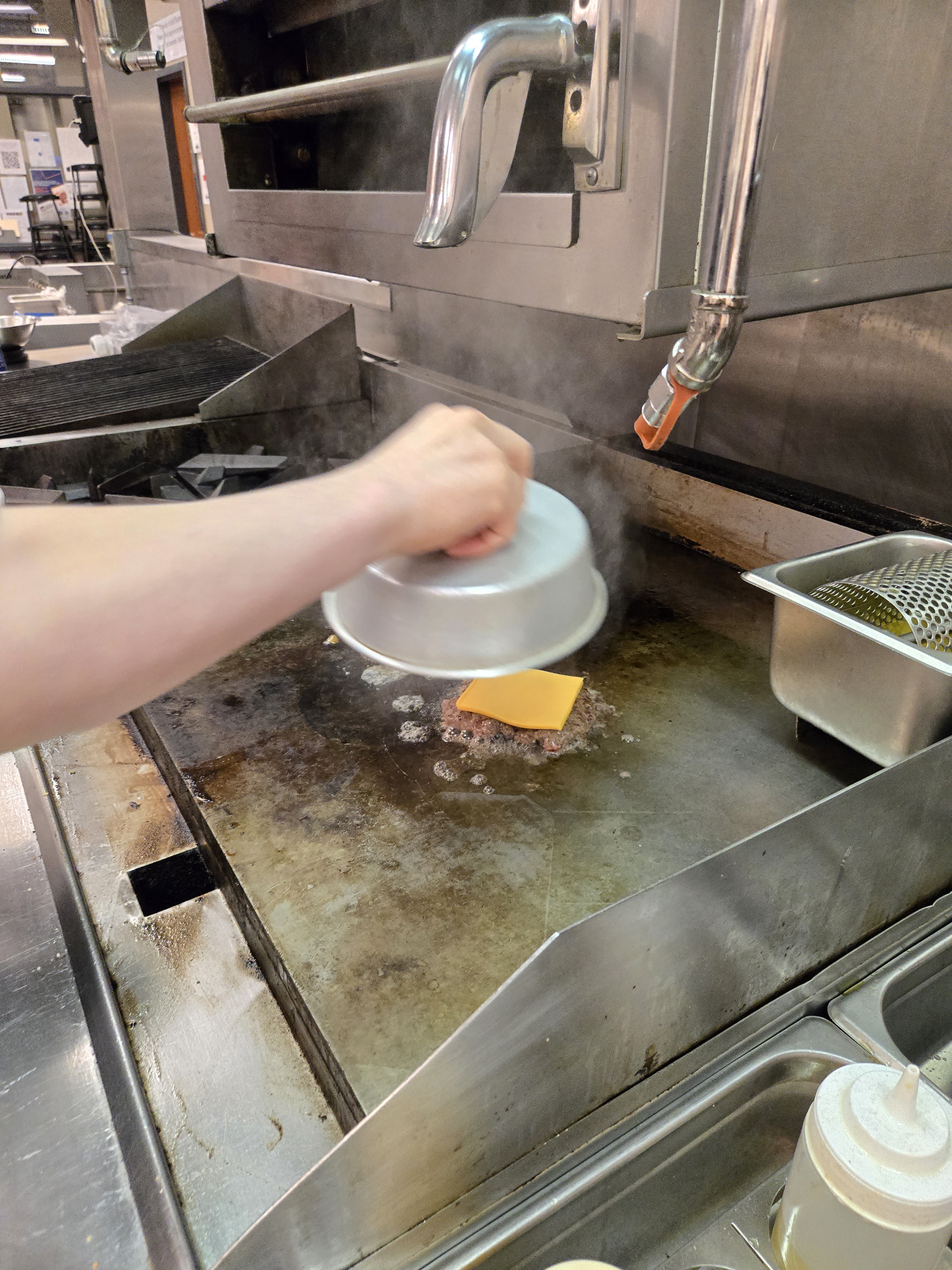 a person in a kitchen preparing food