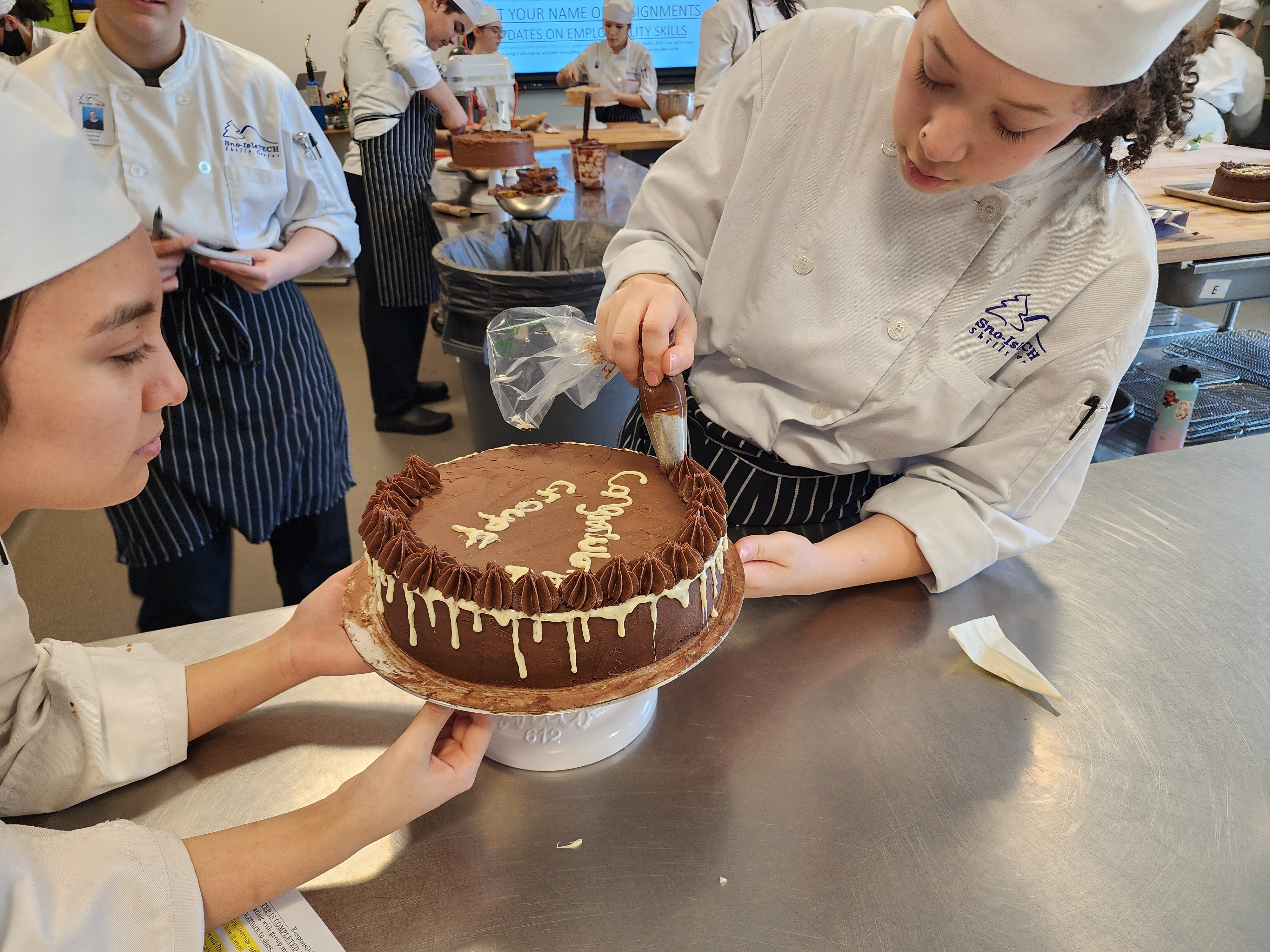 a person holding a birthday cake