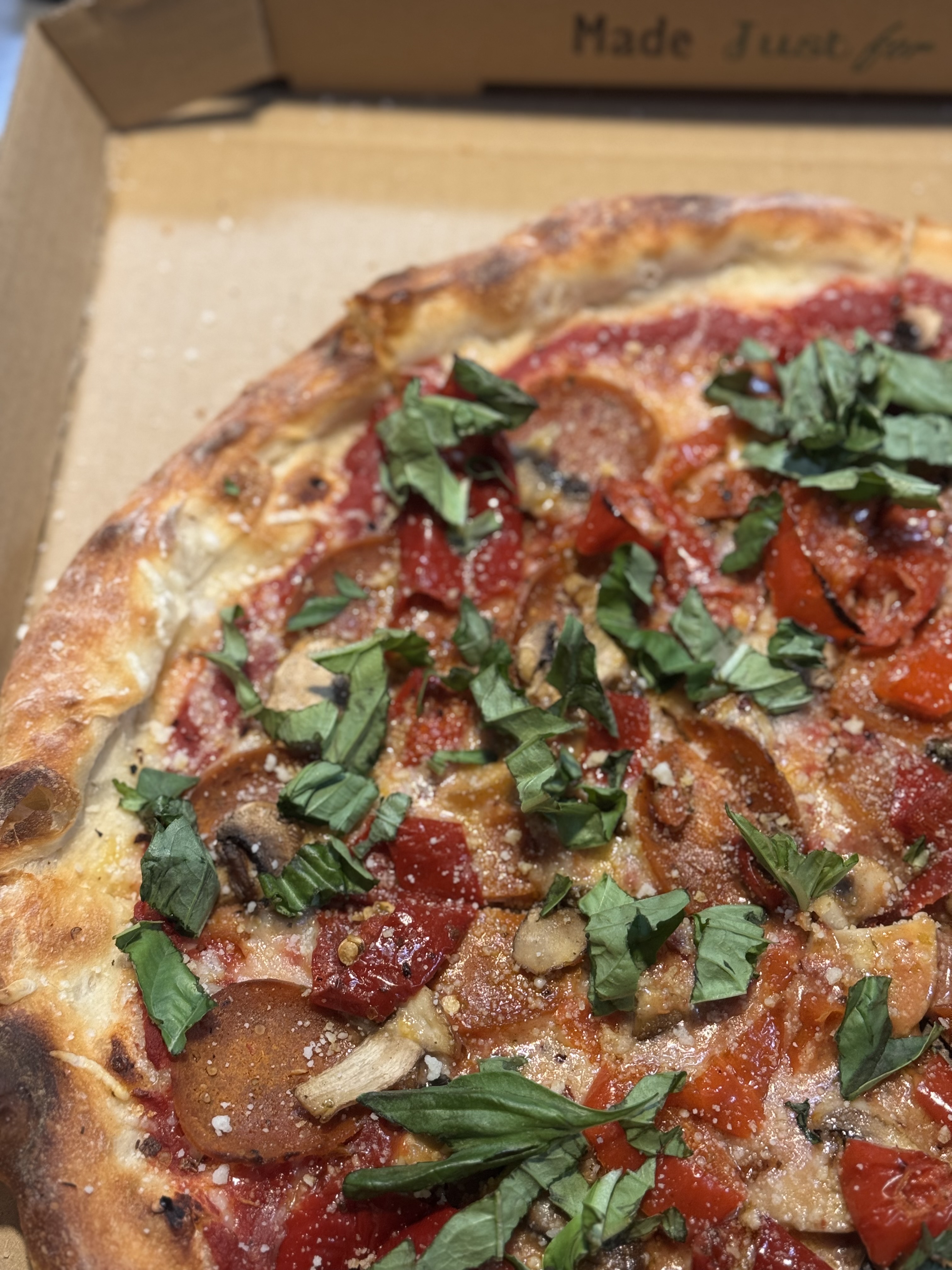 a pizza sitting on top of a box