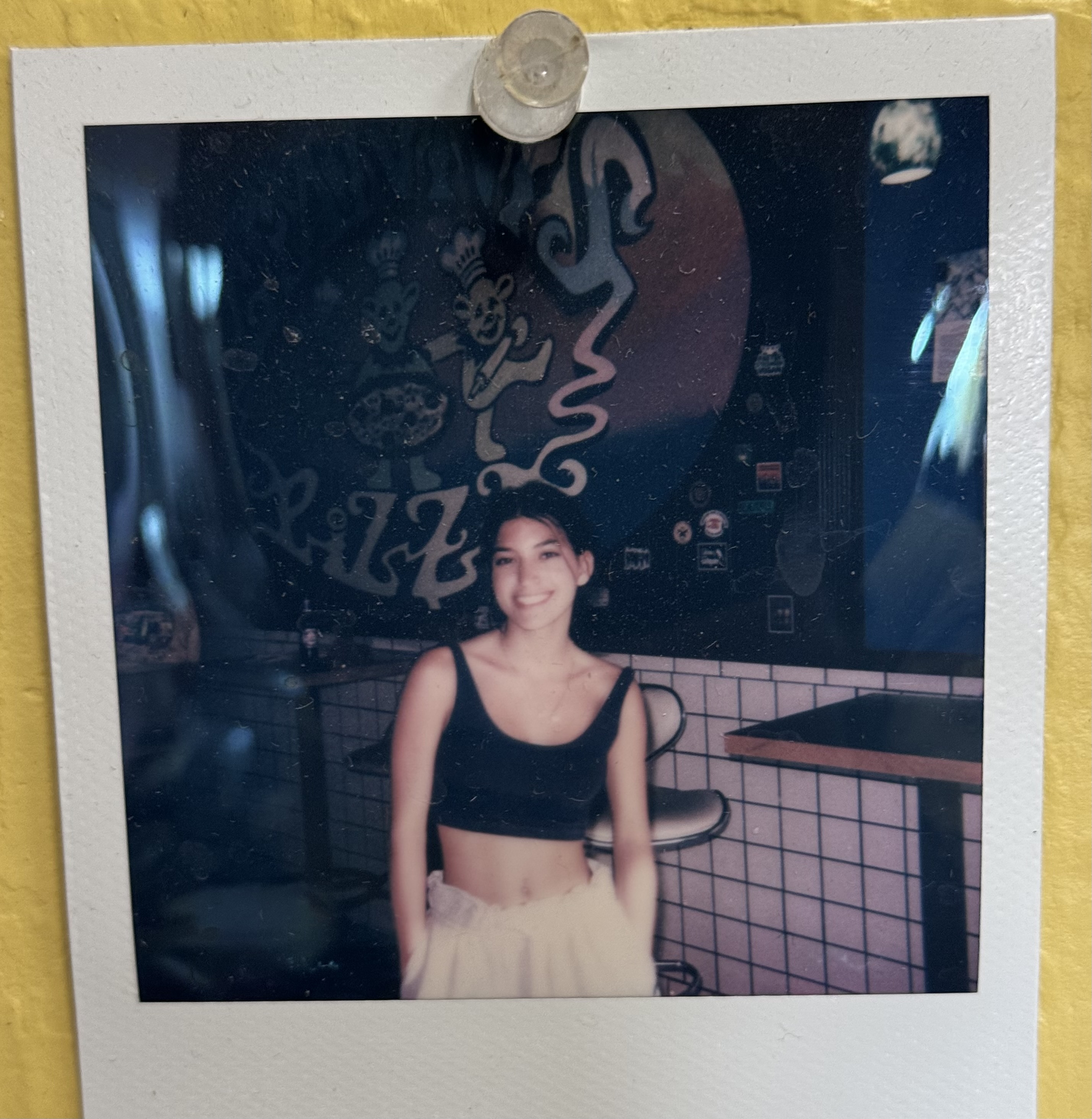 a woman standing in front of a television