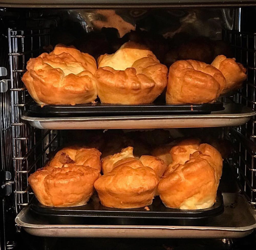 yorkshire puddings cooking in an oven