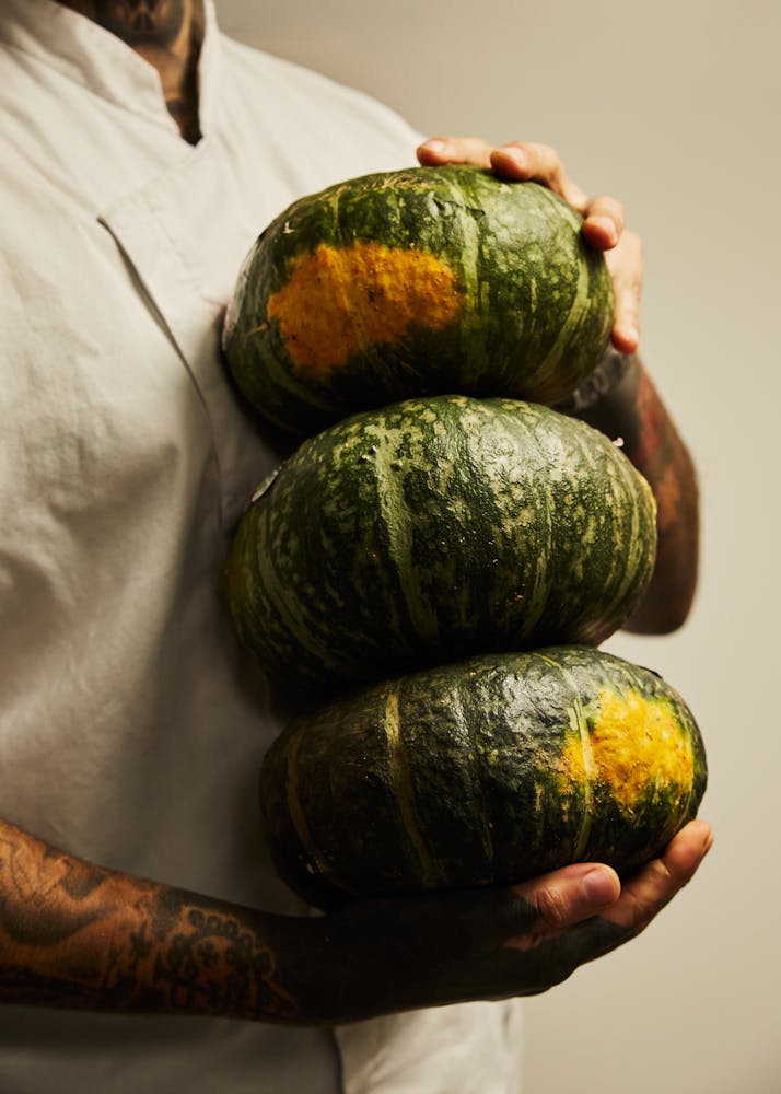 a hand holding a fruit