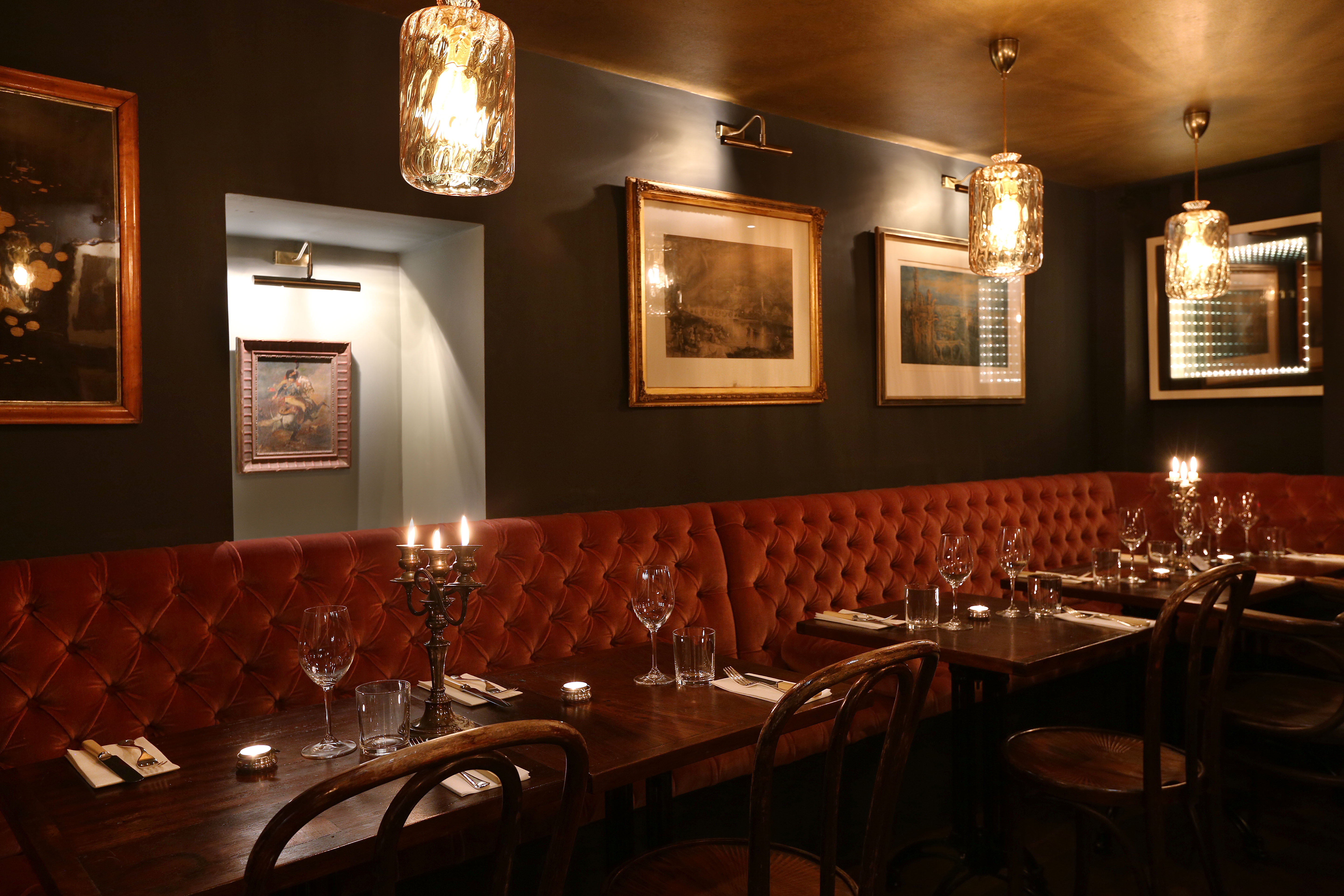 a dining room table with wine glasses