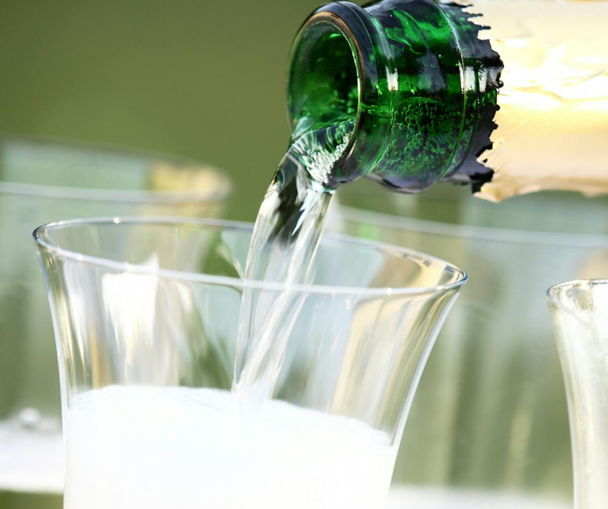 a close up of a beverage in a glass cup on a table
