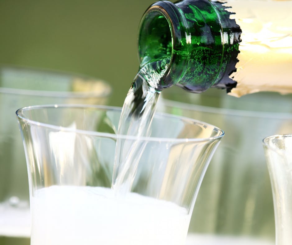 a close up of a beverage in a glass cup on a table