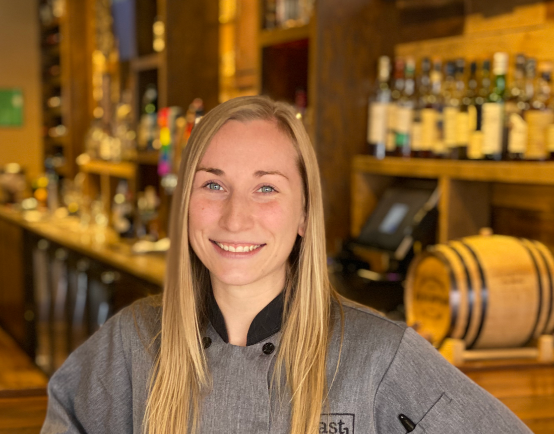 a person sitting at a table in a restaurant
