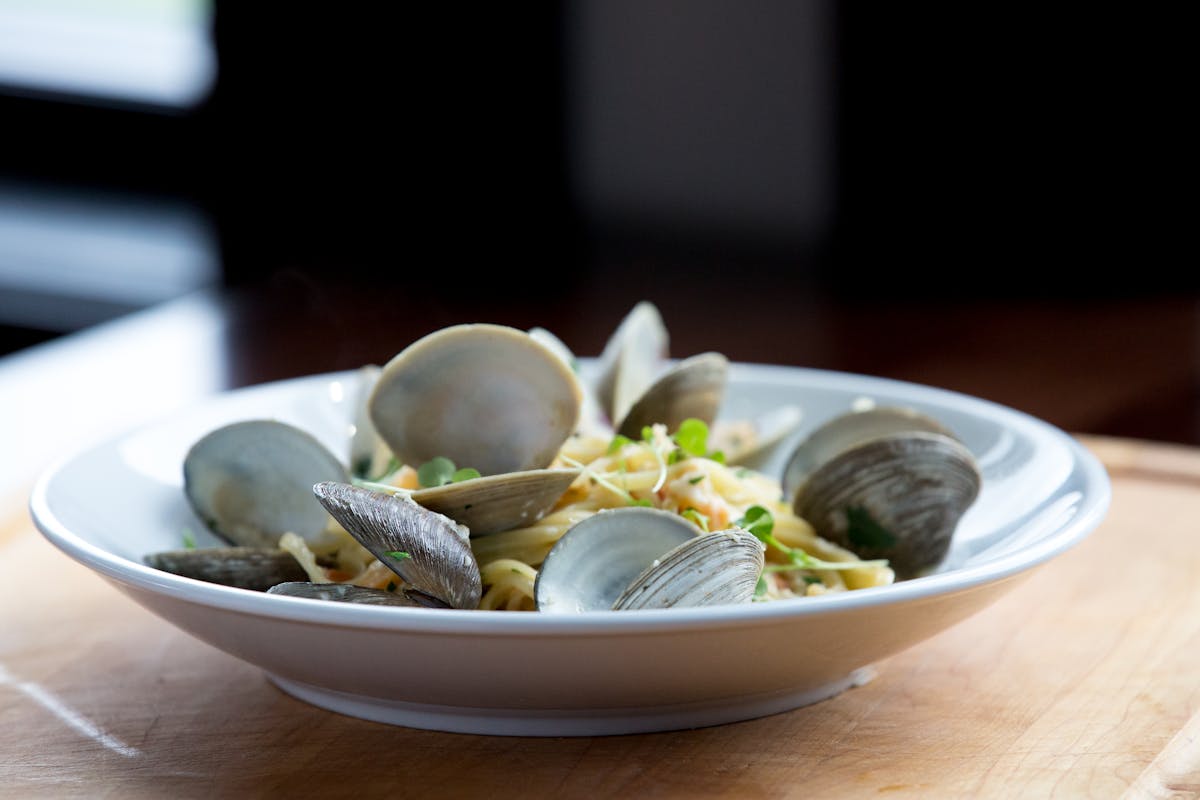 a bowl of food sitting on a table