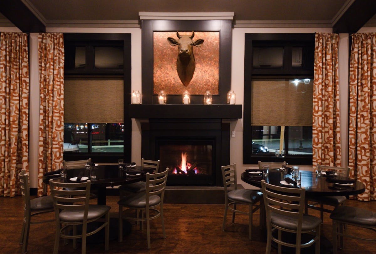 a living room filled with furniture and a fire place