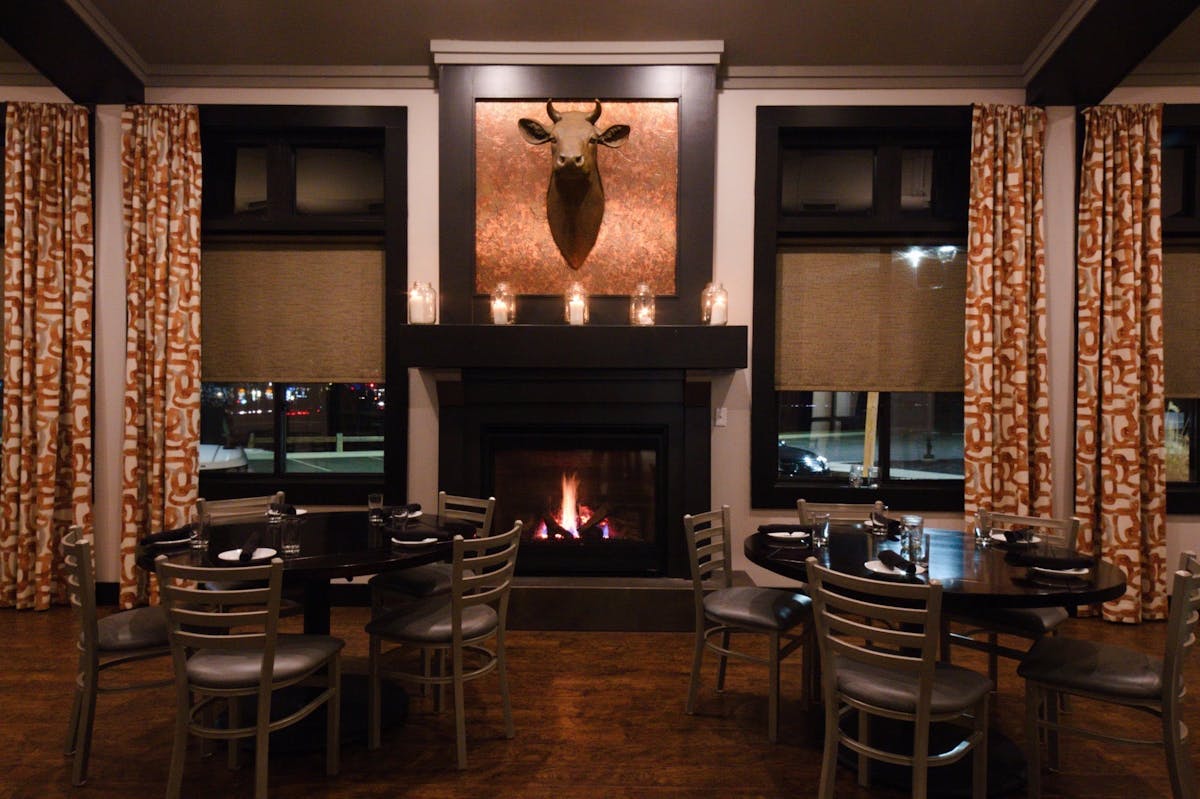 a living room filled with furniture and a fire place