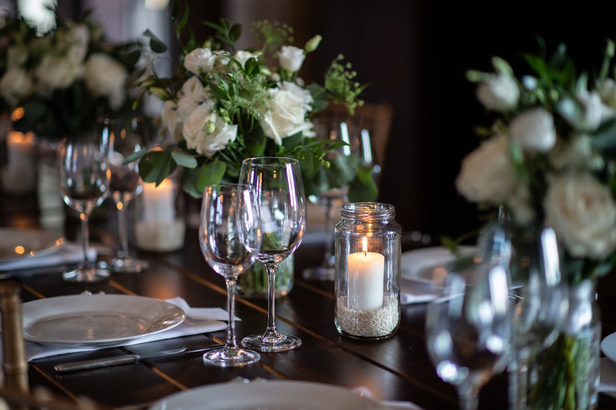 a dining table with wine glasses