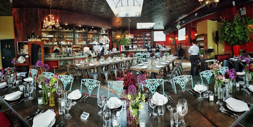 a dining room table filled with wine glasses