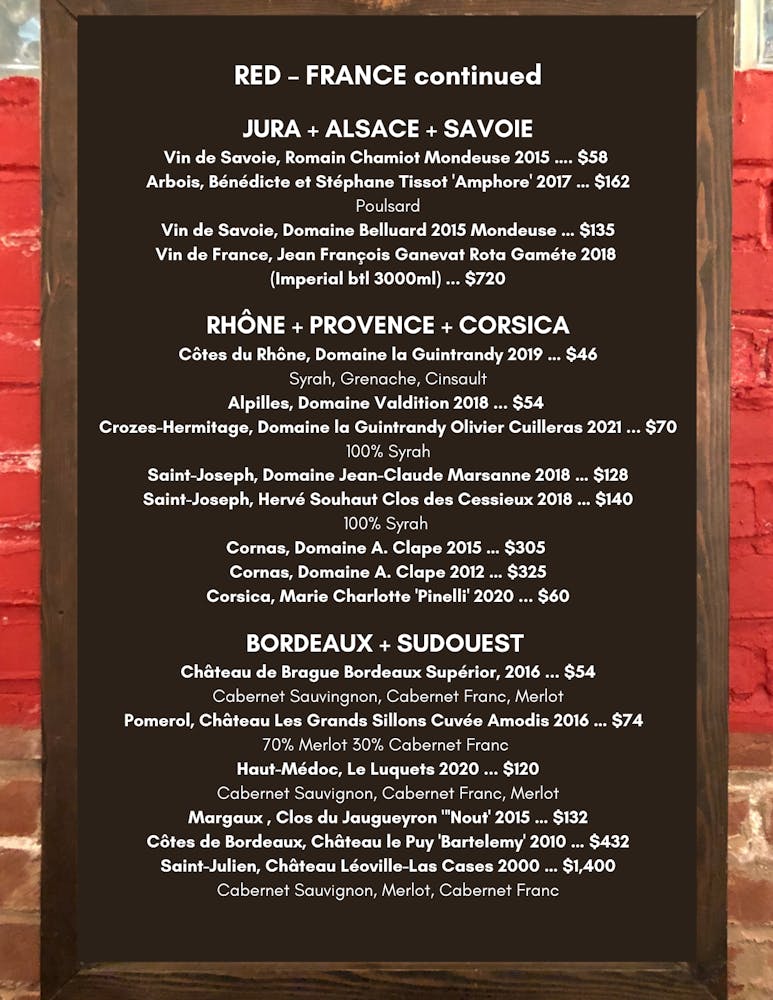 a close up of text on a brick wall