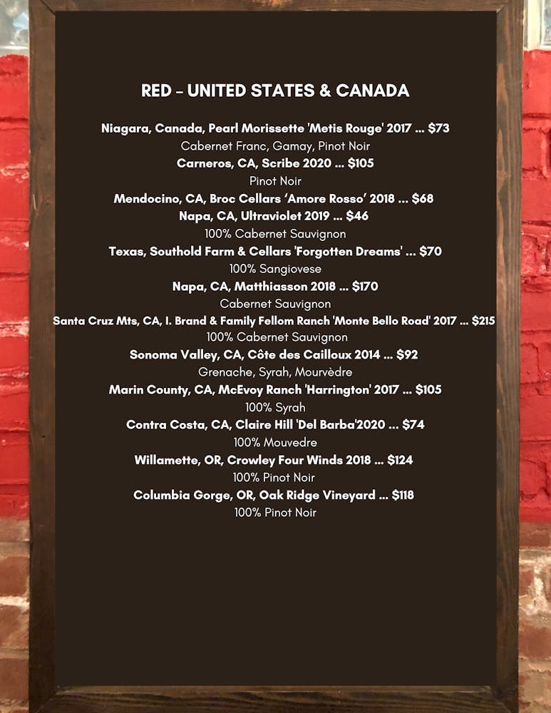 a close up of text on a brick wall