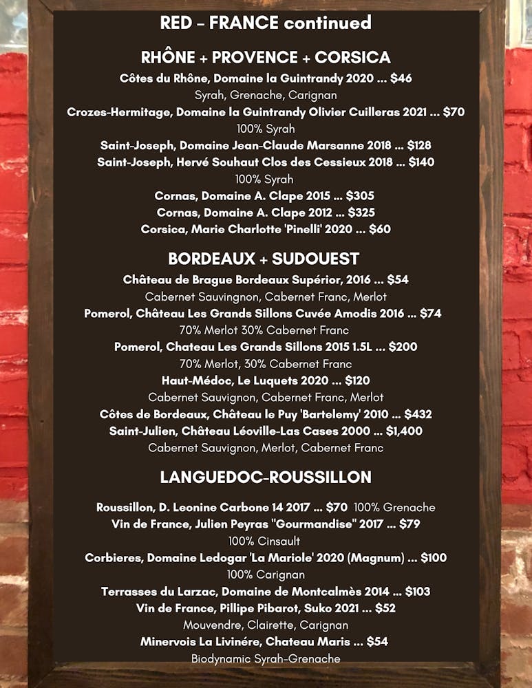 a close up of text on a brick wall