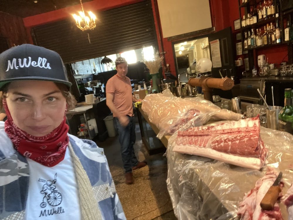 a person sitting at a table with a hat