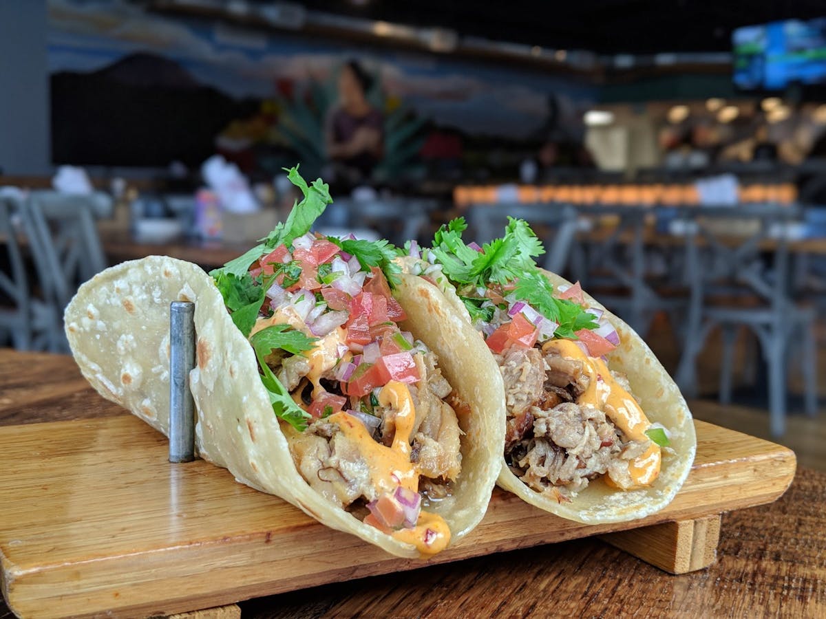 food sitting on top of a wooden cutting board