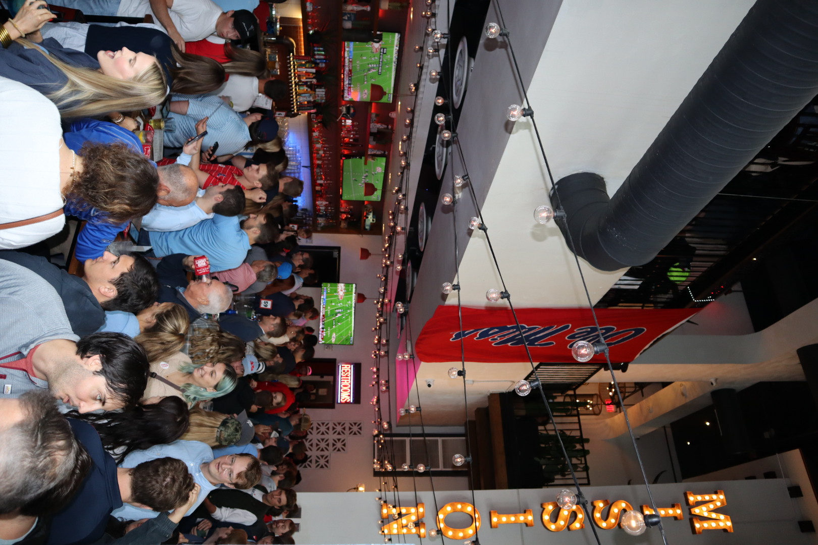 a group of people standing in front of a crowd