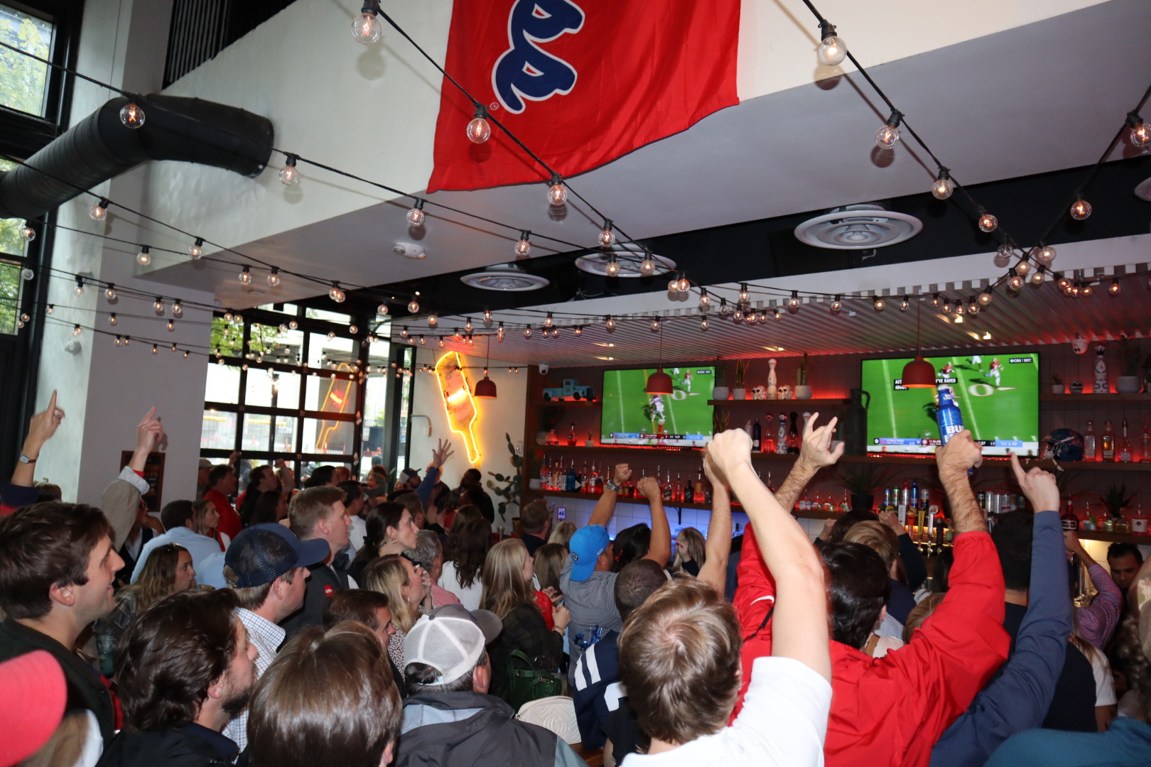 a group of people standing in front of a crowd