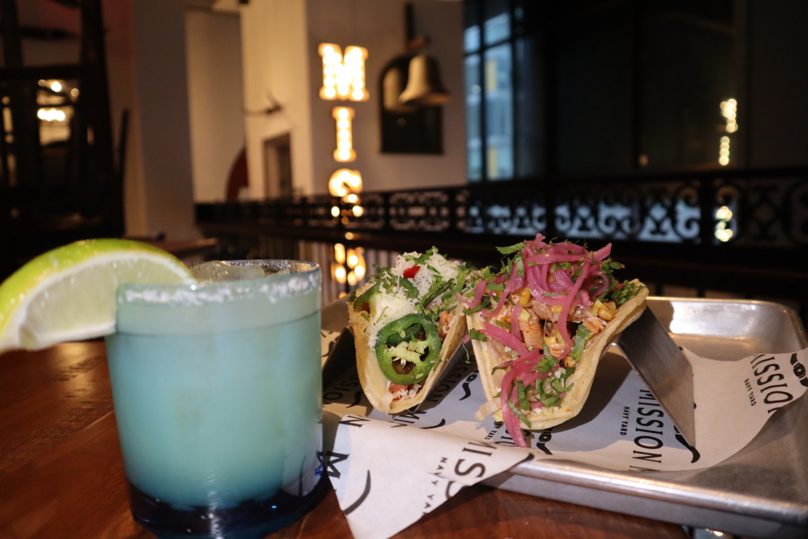 a cup of coffee and a glass of beer on a table