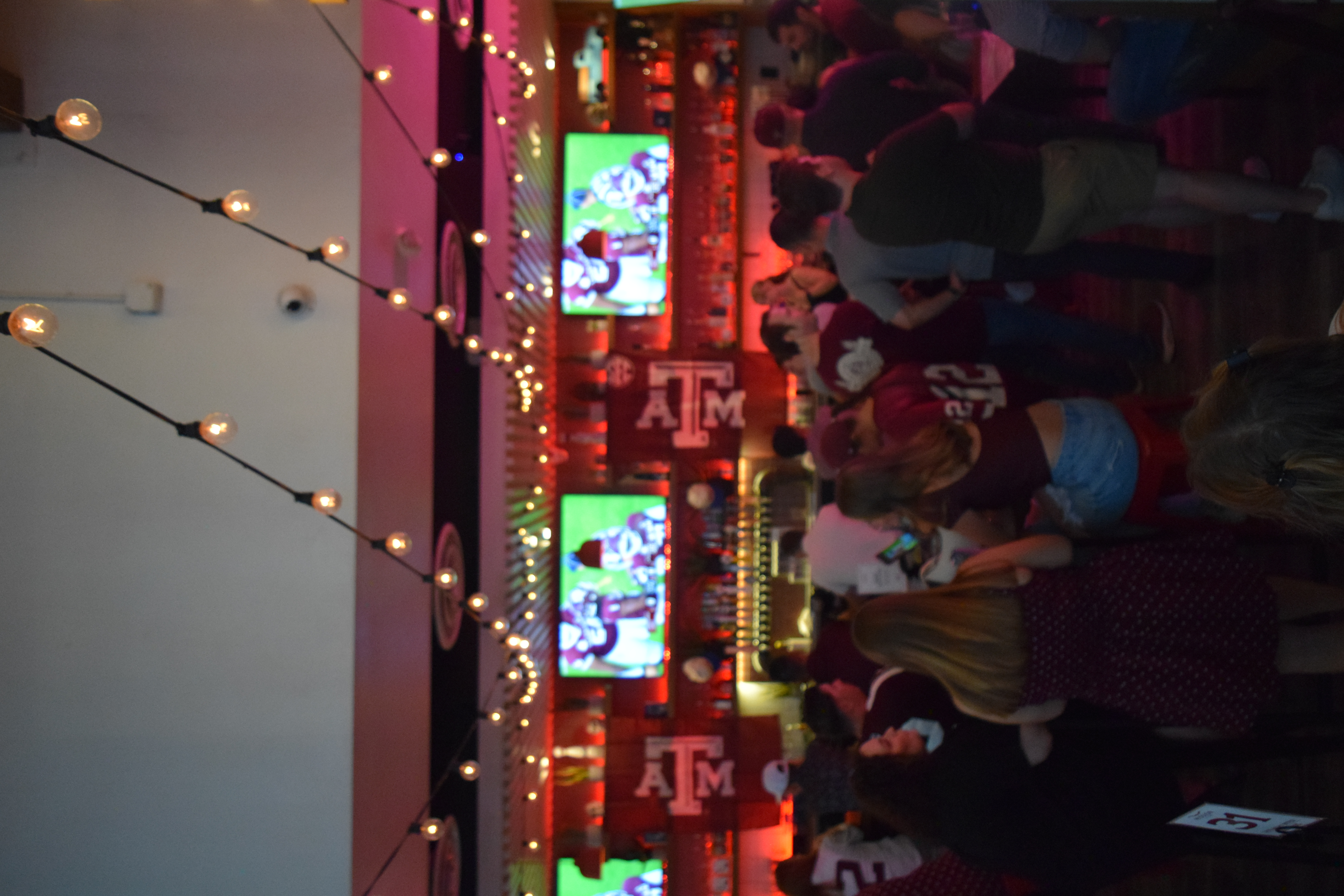 a group of people in a bar