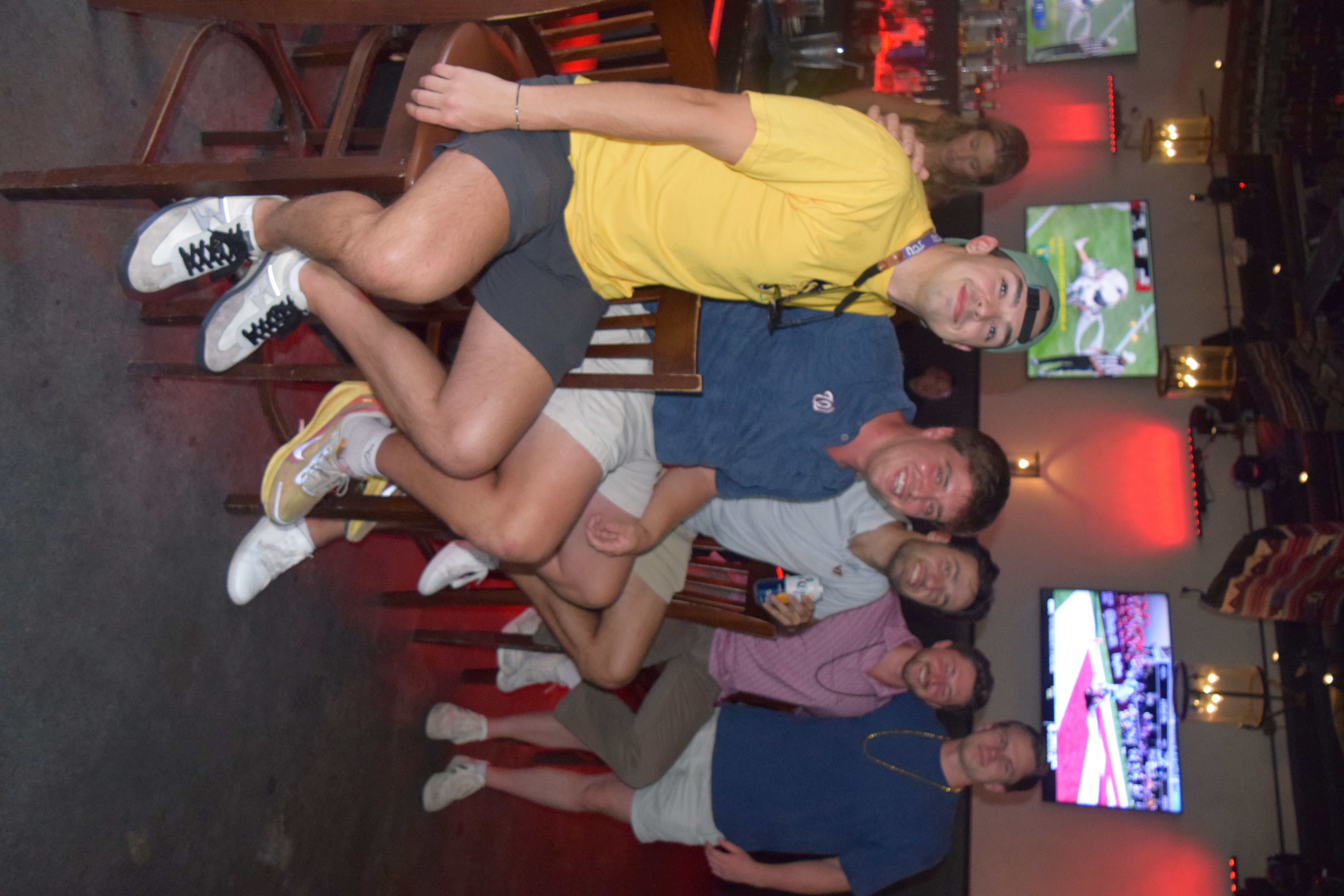 a group of men sitting on chairs