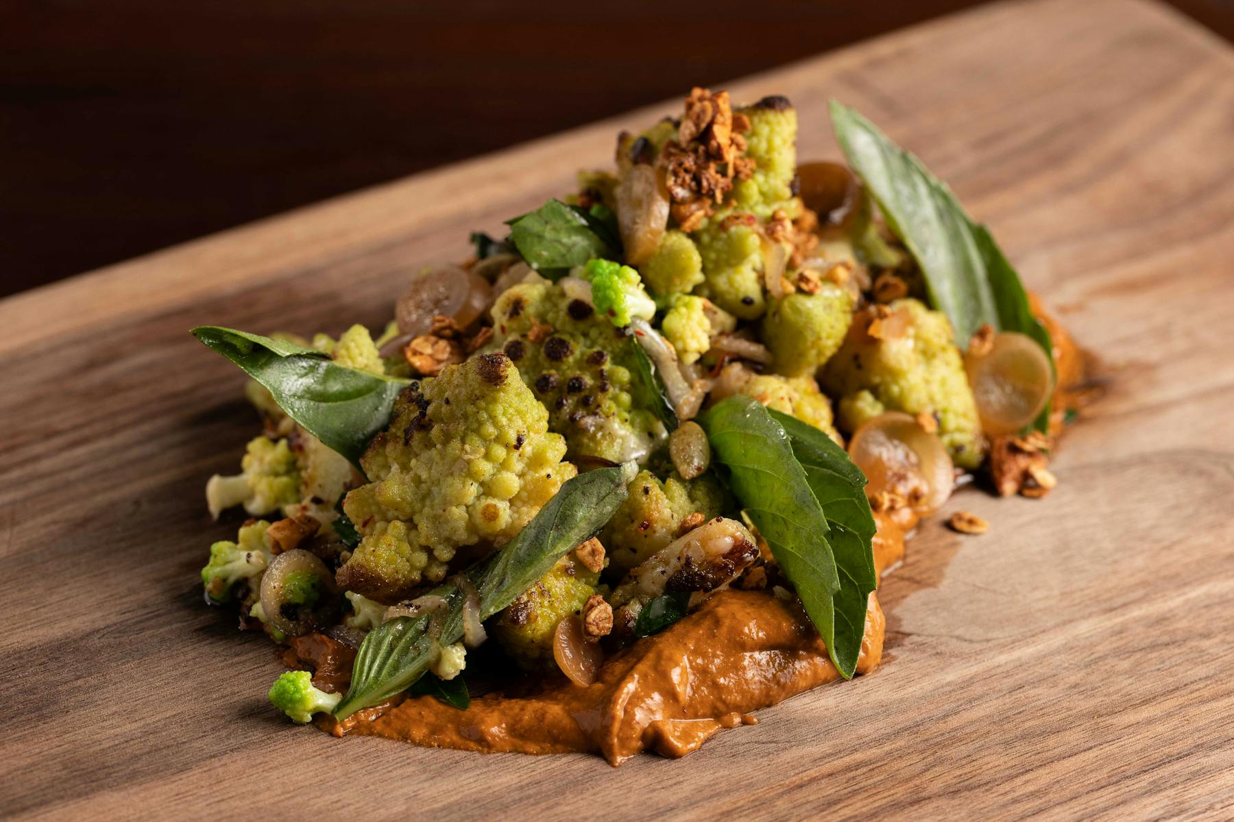 a plate of food sitting on top of a wooden table