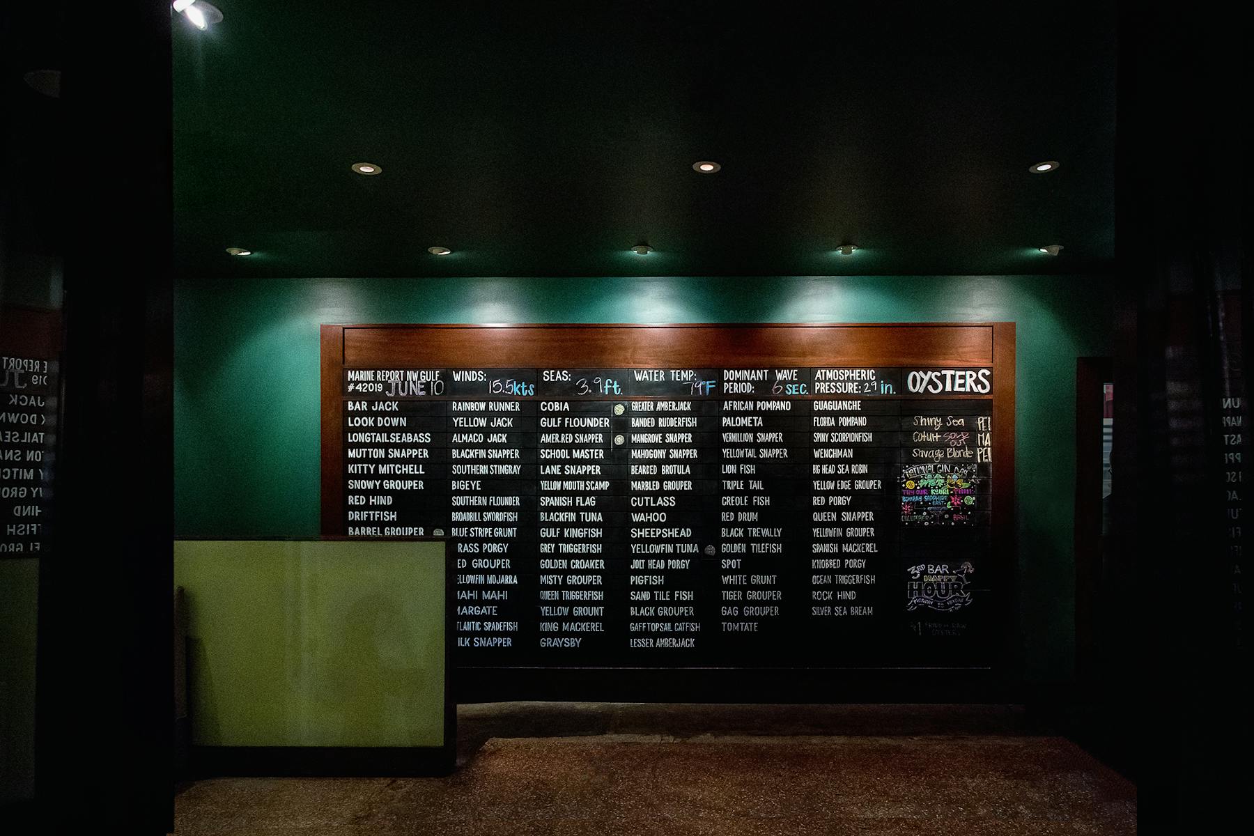 a black sign with white text on screen