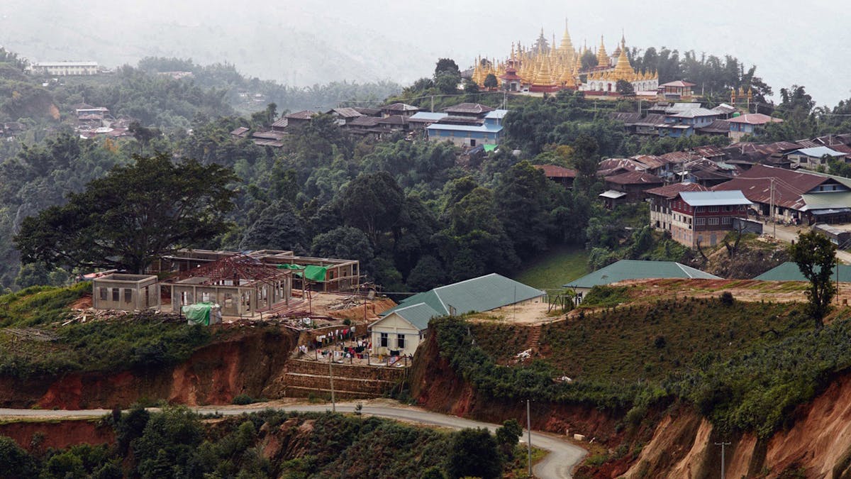 a view of a city with a mountain in the background