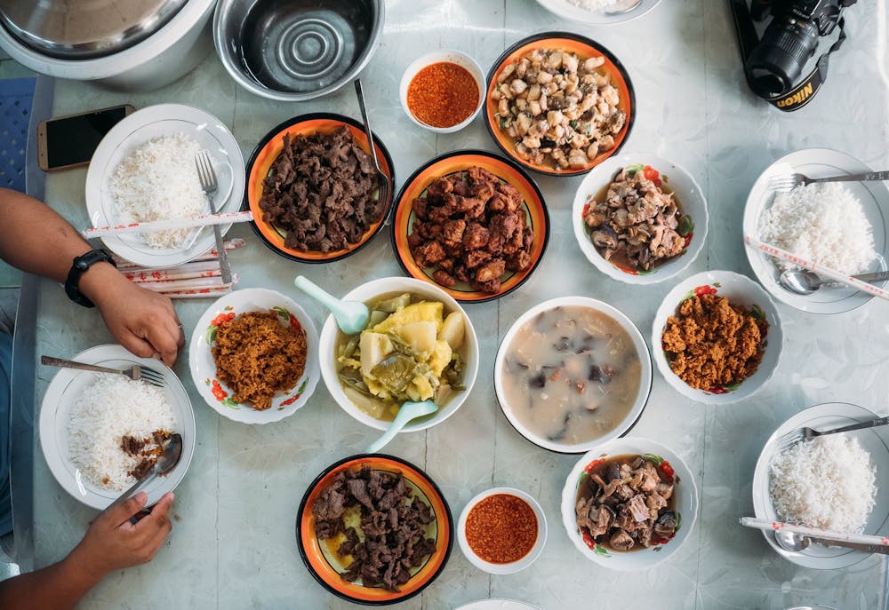 a dish is filled with different types of food on a table