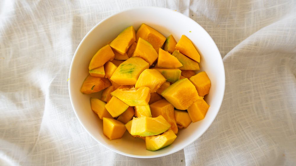 a bowl of fruit on a plate