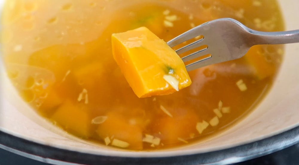 a bowl of soup and a spoon