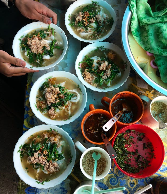 a bowl filled with different types of food on a table