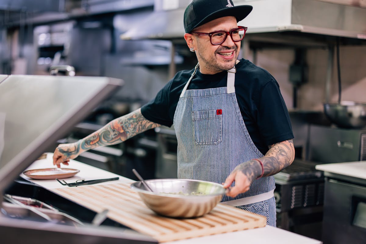 a man preparing food in a kitchen