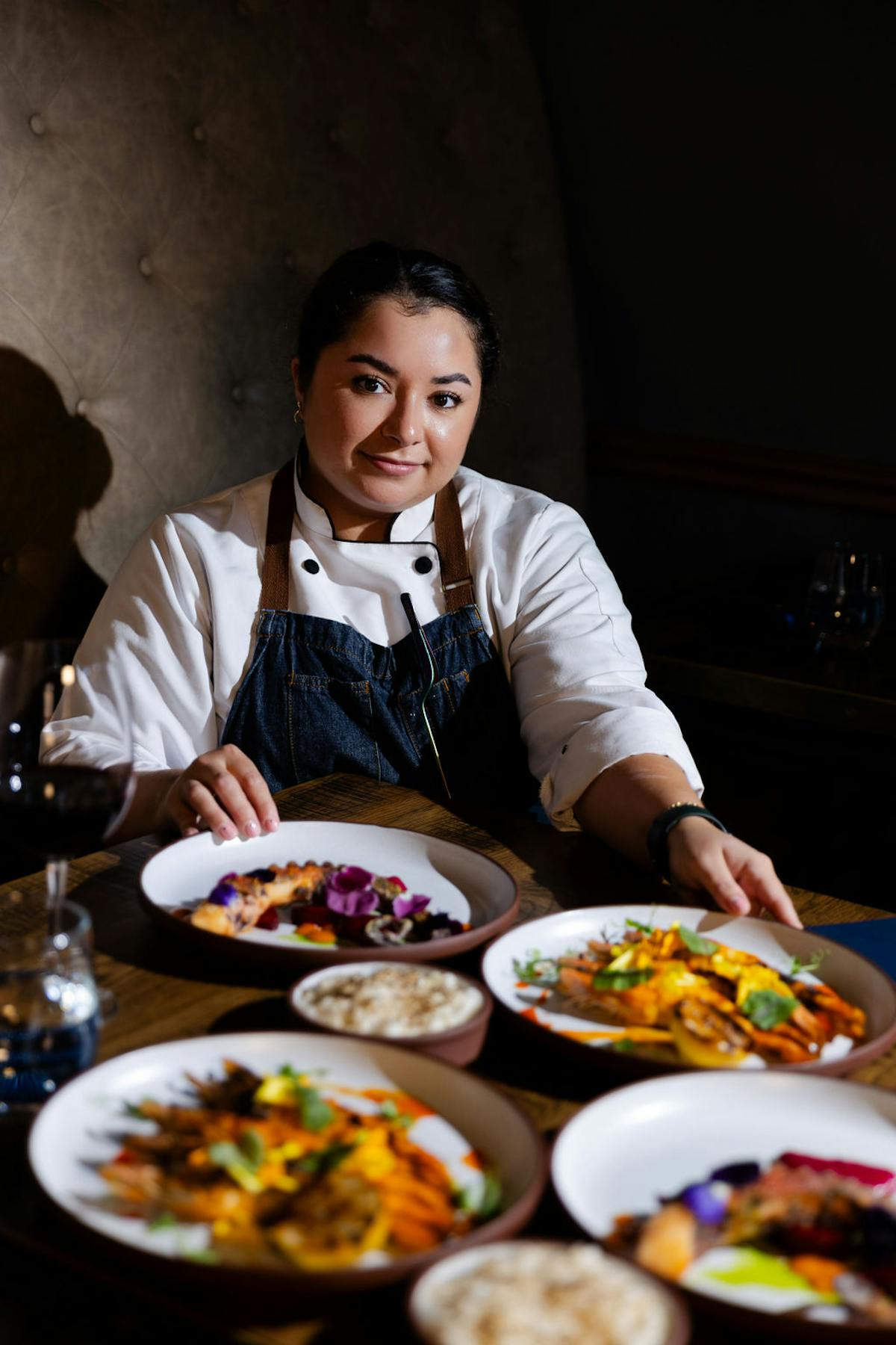 a person sitting at a table with a plate of food