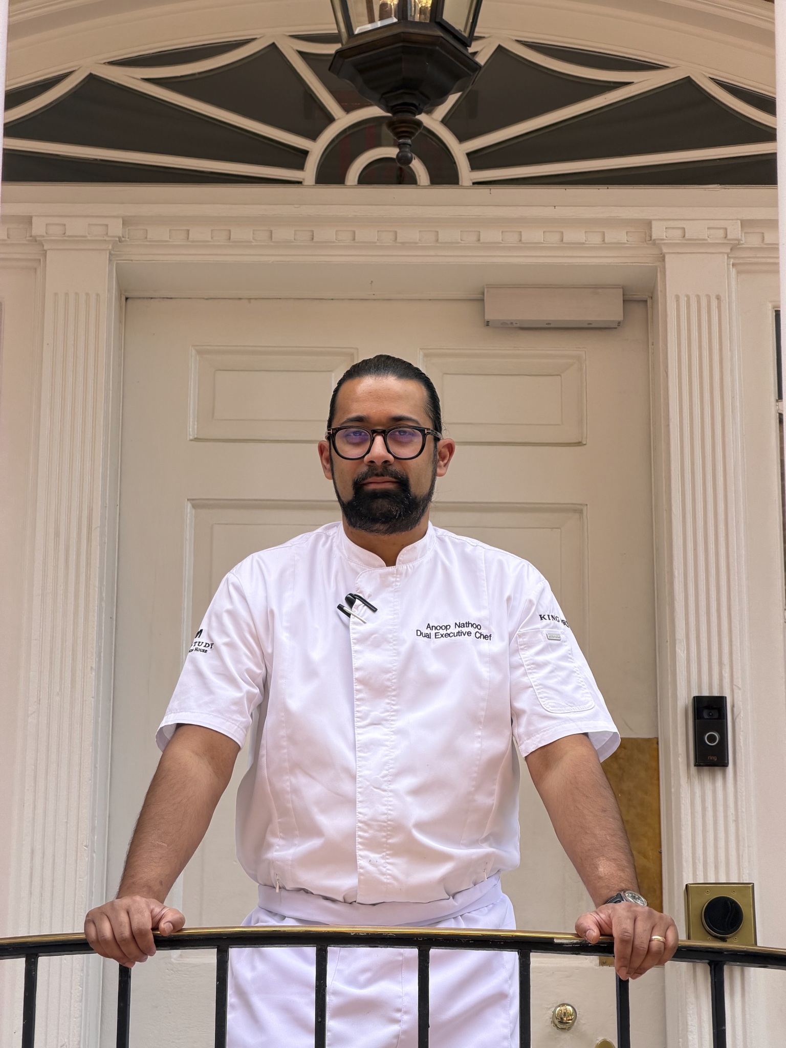 a man in a white chef's uniform