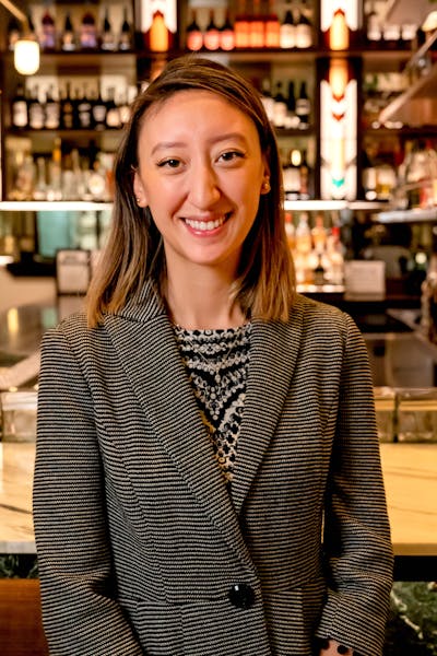 Suzanne Pringle standing in front of a store