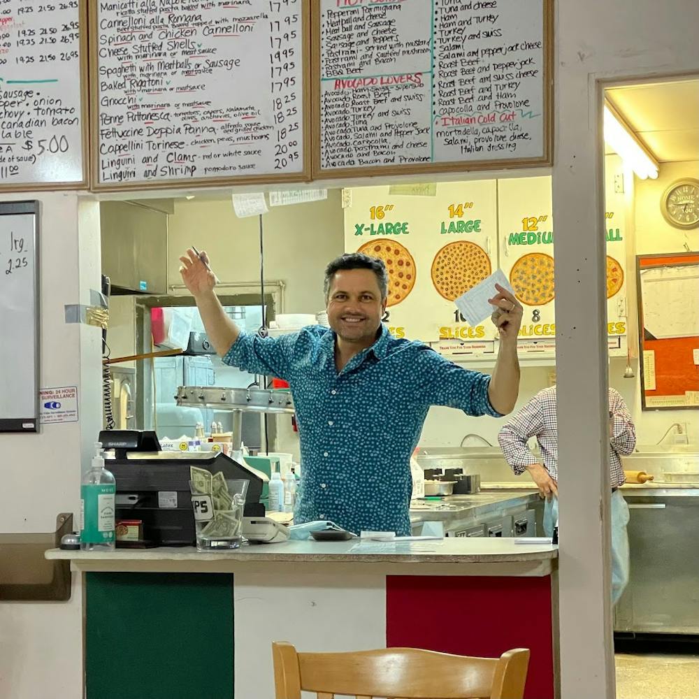 a person standing in front of a store