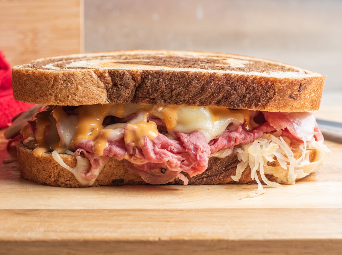 a cut in half sandwich sitting on top of a table