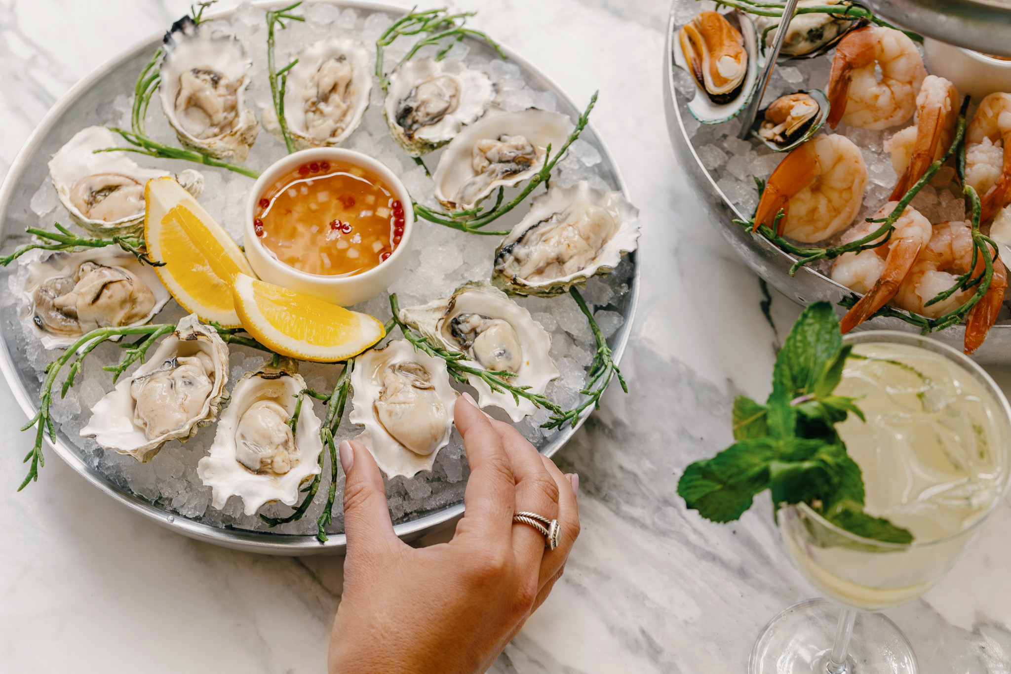 a plate of oysters and lemons