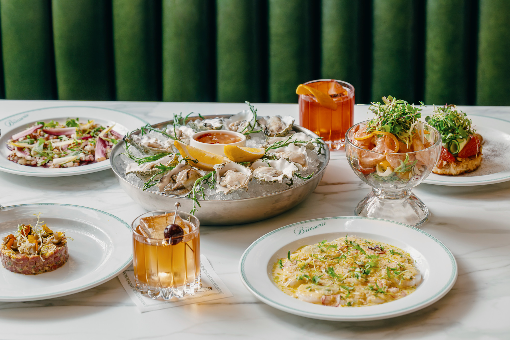a table with plates of food and drinks